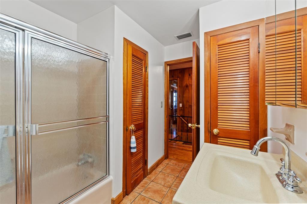 3461 Gum Drive Weeki Wachee, FL 34607 - Photo 29 of 48 a bathroom with a tub and shower