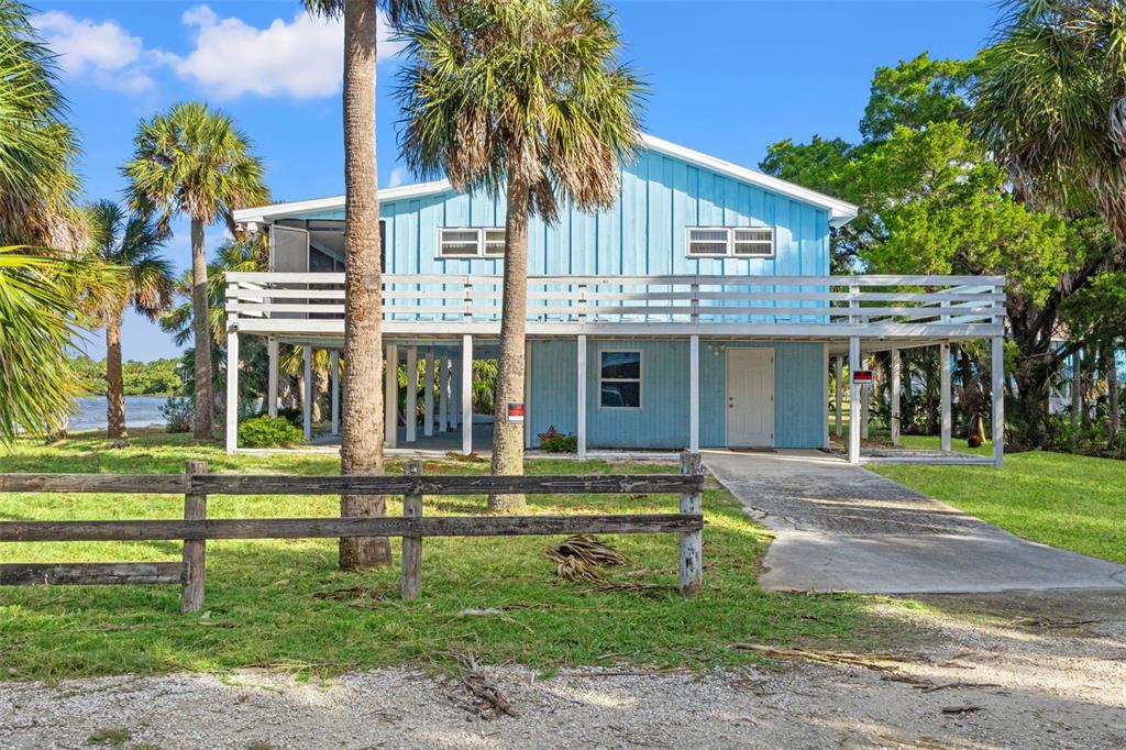 3461 Gum Drive Weeki Wachee, FL 34607 - Photo 45 of 48 a front view of a house with a yard