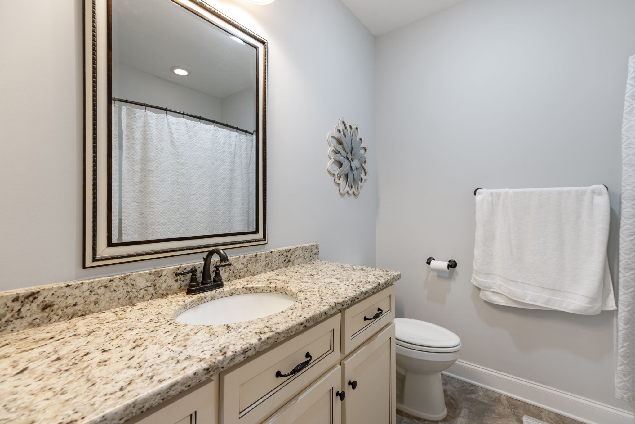 4120 Turnberry Road Spring Hill, TN 37174 - Photo 12 of 48 a bathroom with a granite countertop sink mirror vanity and toilet
