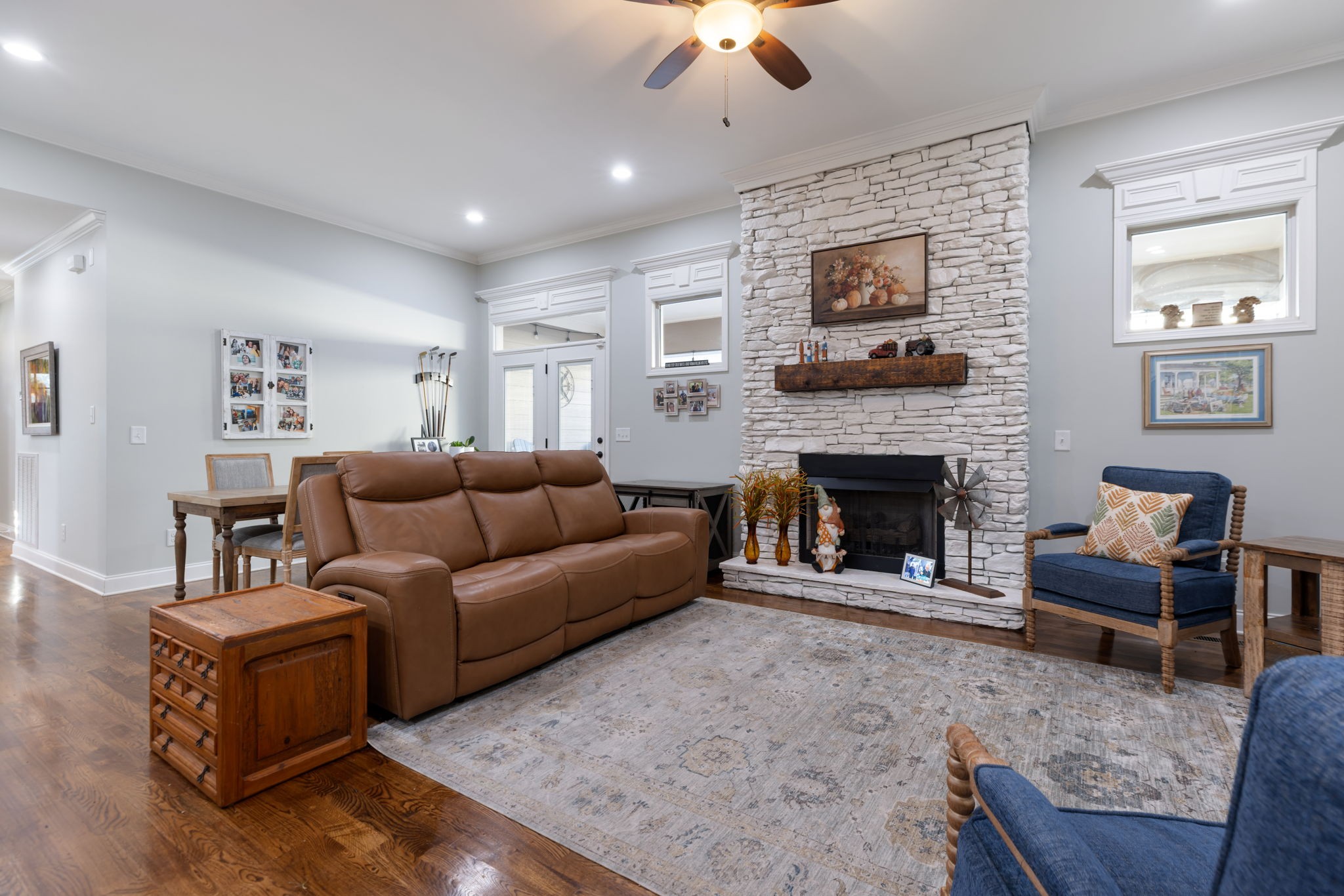 4120 Turnberry Road Spring Hill, TN 37174 - Photo 18 of 48 a living room with furniture a flat screen tv and a fireplace