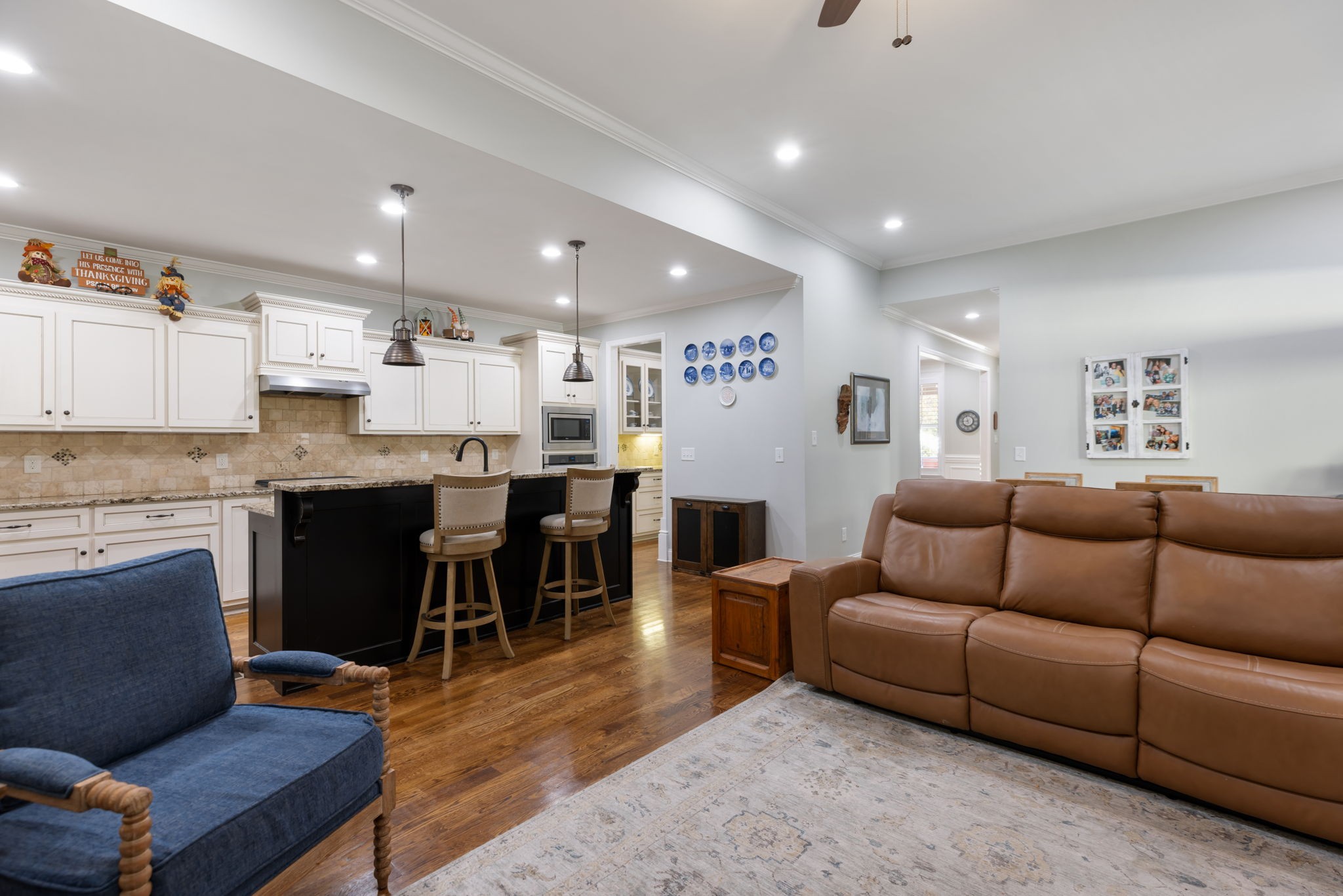 4120 Turnberry Road Spring Hill, TN 37174 - Photo 20 of 48 a living room kitchen with a dining table wooden floor furniture and kitchen view