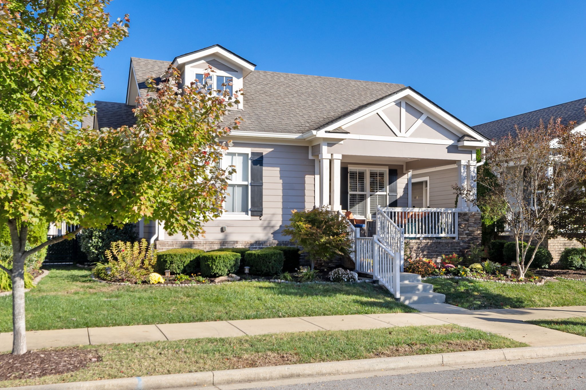 4120 Turnberry Road Spring Hill, TN 37174 - Photo 2 of 48 a front view of a house with a yard and potted plants
