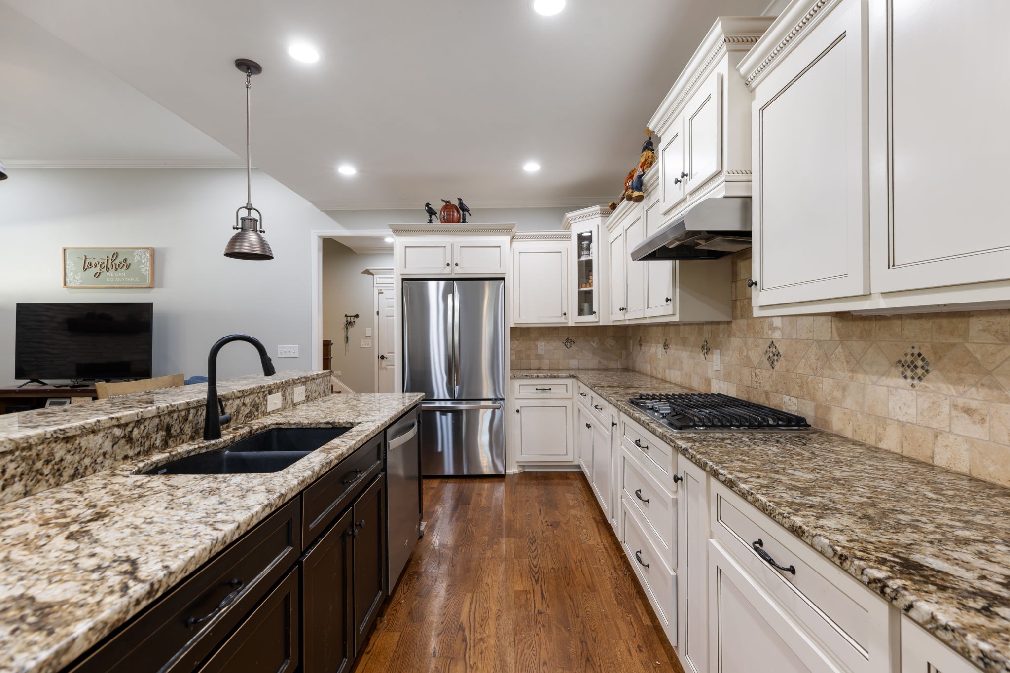 4120 Turnberry Road Spring Hill, TN 37174 - Photo 23 of 48 a kitchen with stainless steel appliances granite countertop a sink stove and refrigerator