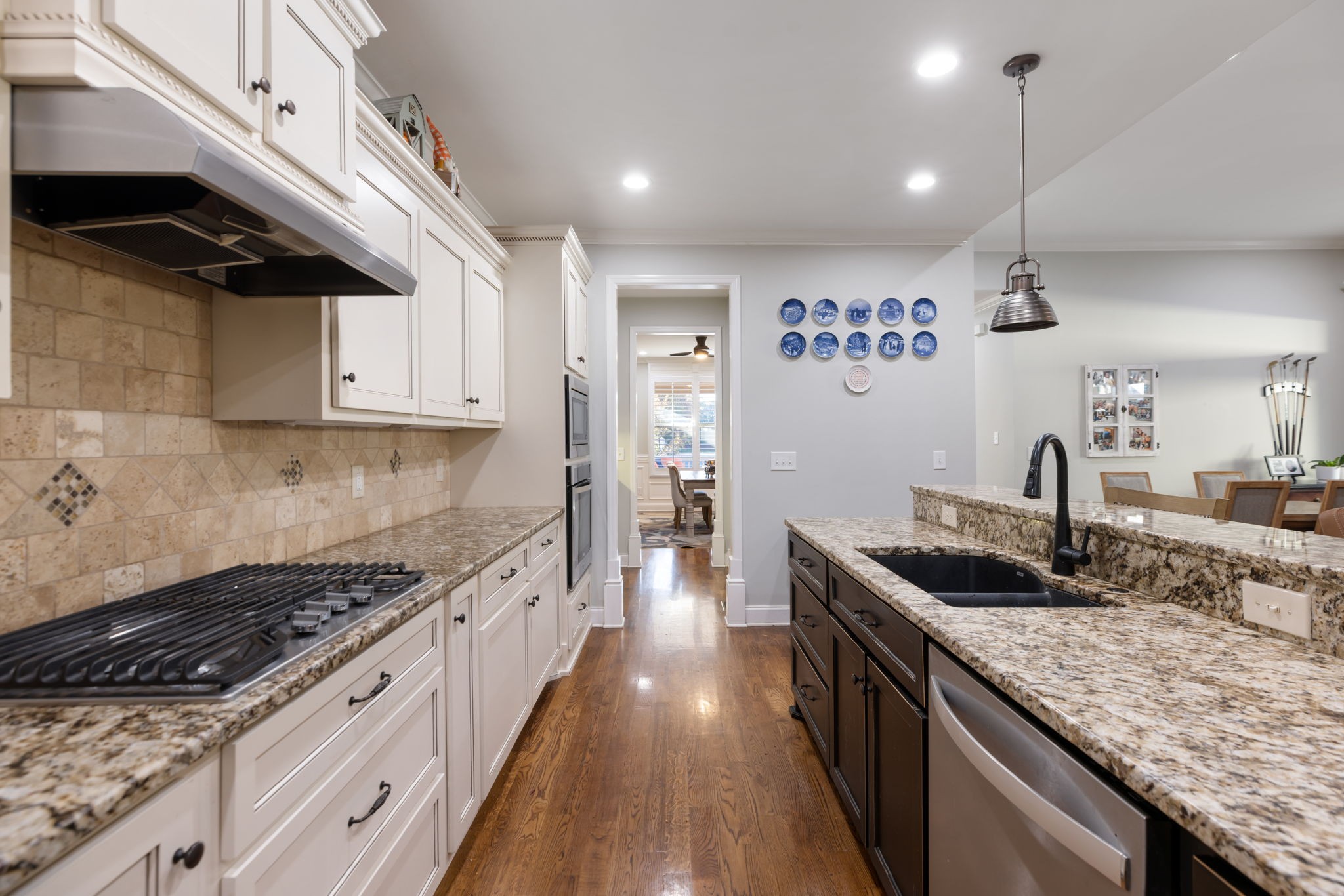 4120 Turnberry Road Spring Hill, TN 37174 - Photo 24 of 48 a kitchen with granite countertop stainless steel appliances and wooden cabinets