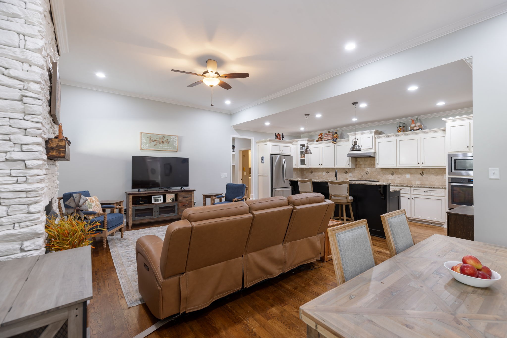4120 Turnberry Road Spring Hill, TN 37174 - Photo 26 of 48 a living room with furniture a fireplace and a flat screen tv