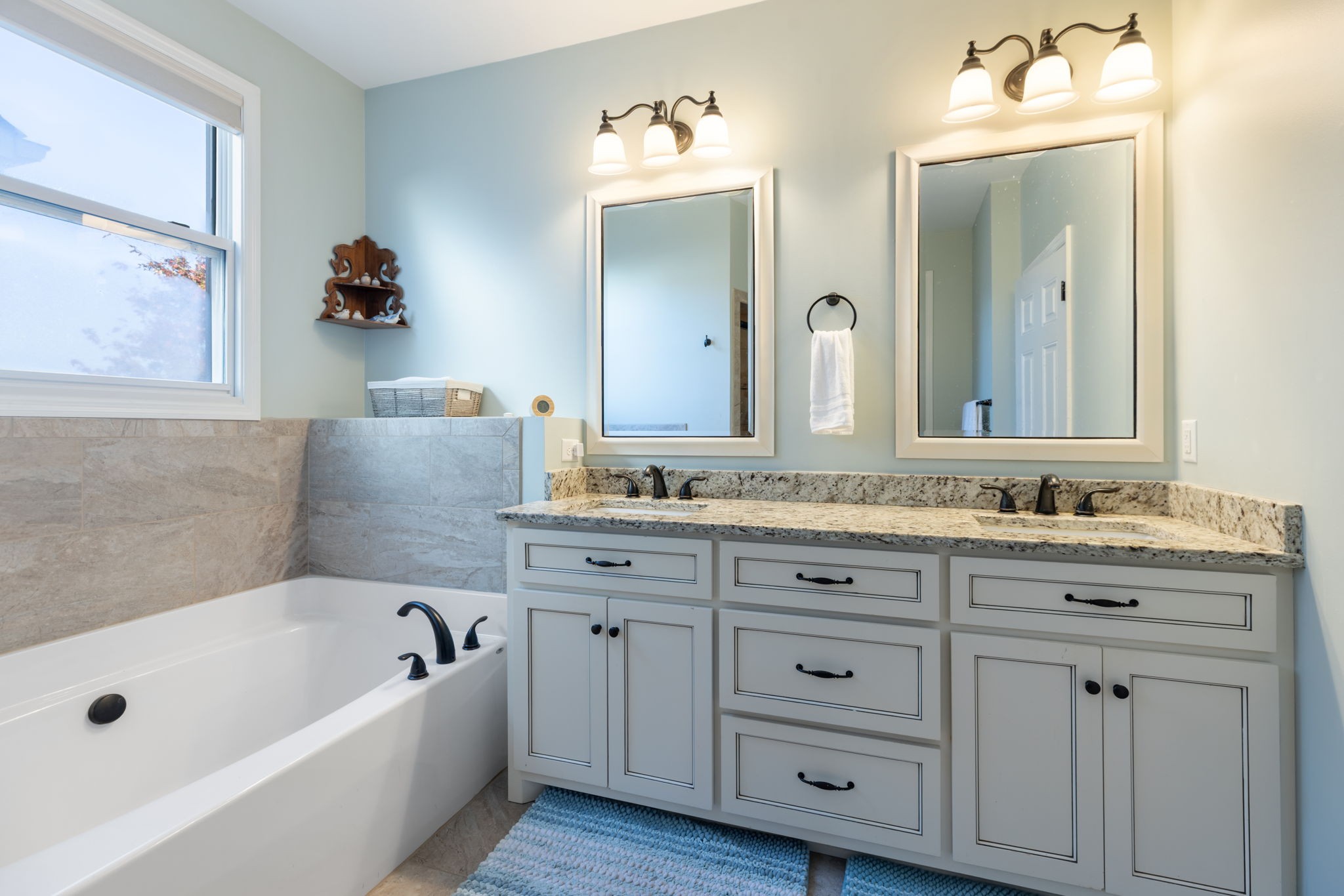 4120 Turnberry Road Spring Hill, TN 37174 - Photo 38 of 48 a bathroom with a tub a double vanity sink and mirror