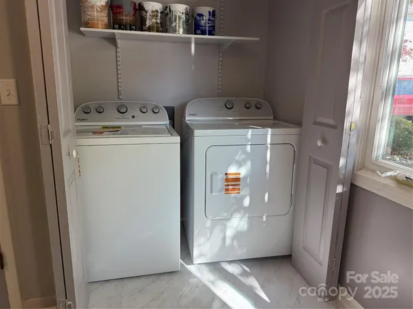 a utility room with dryer and washer