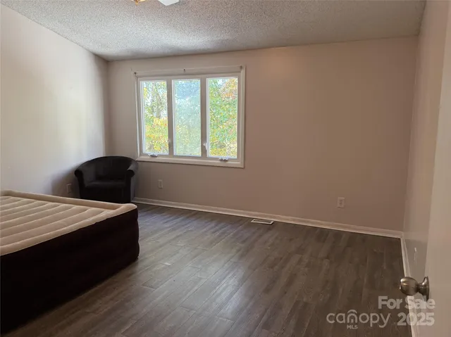 a room with a bed and a window