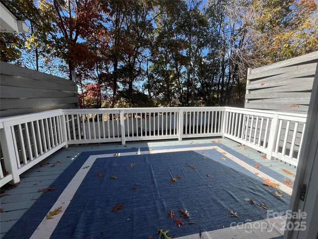 a view of deck with wooden floor and fence