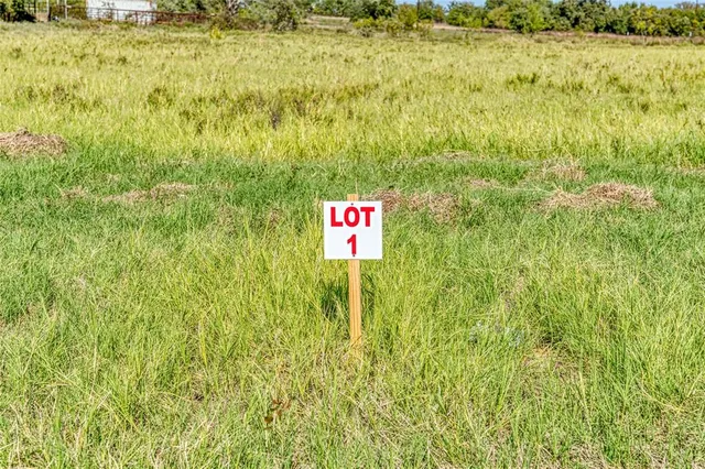 a view of a large body of water with a building in the background