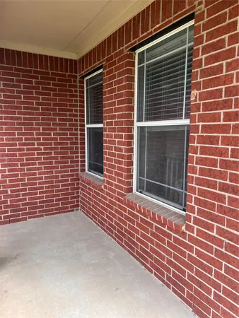 a view of brick building with a window