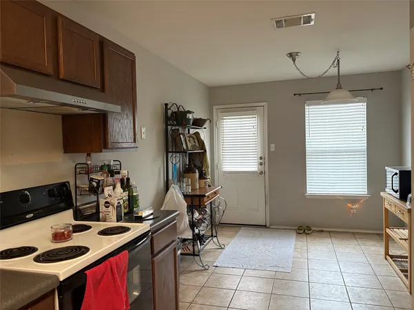 a view of a kitchen with workspace and a window