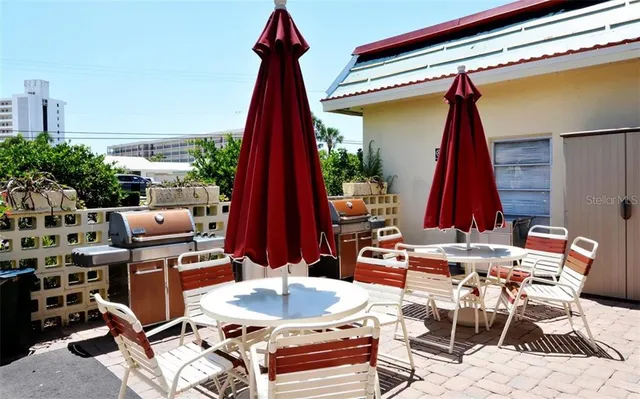 a view of a swimming pool with outdoor seating