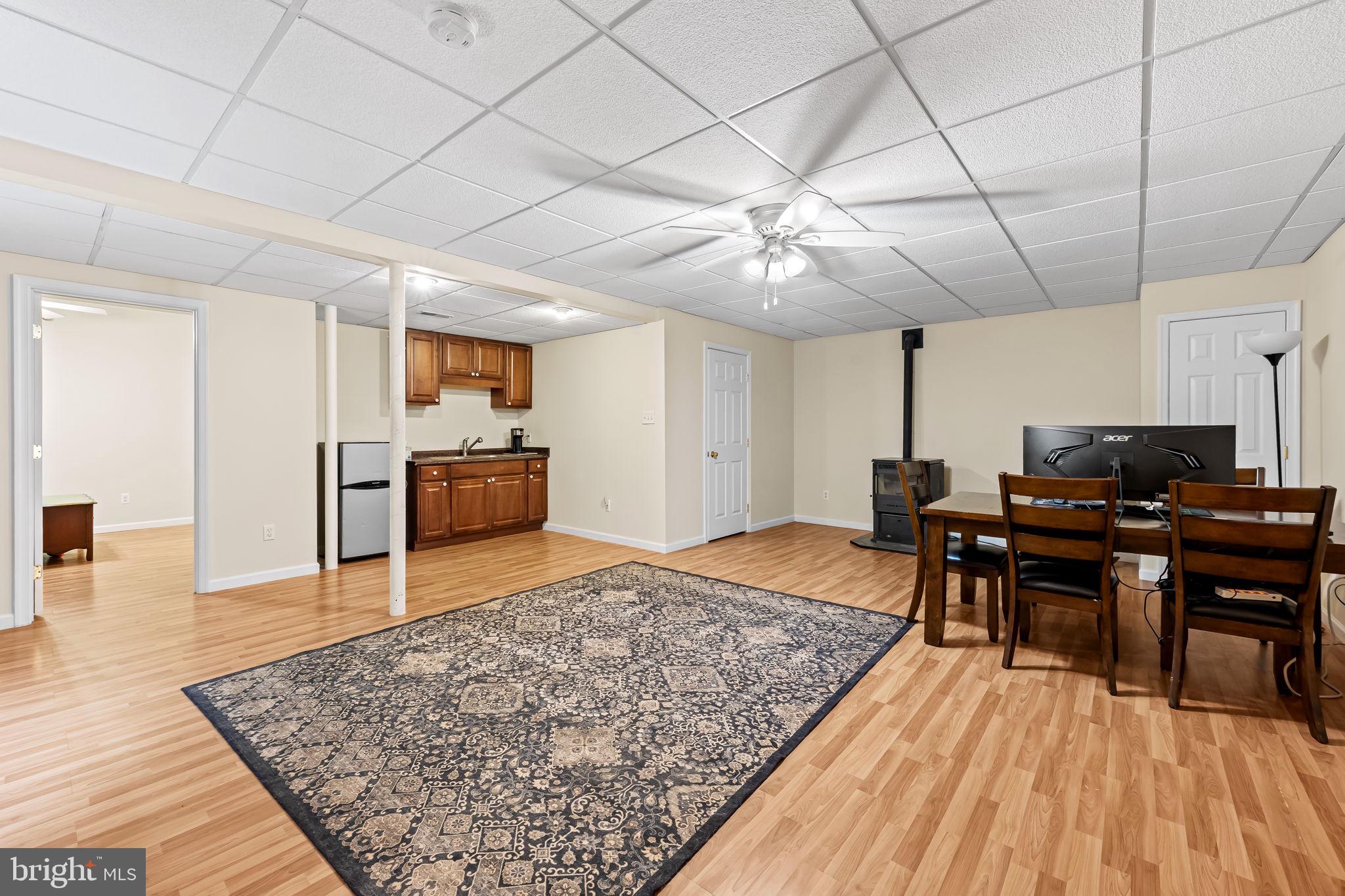 1564 Colony Road Pasadena, MD 21122 - Photo 29 of 40 Lower level with pellet stove, kitchenette