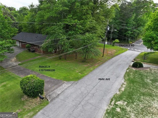 a backyard of a house with a yard and outdoor seating