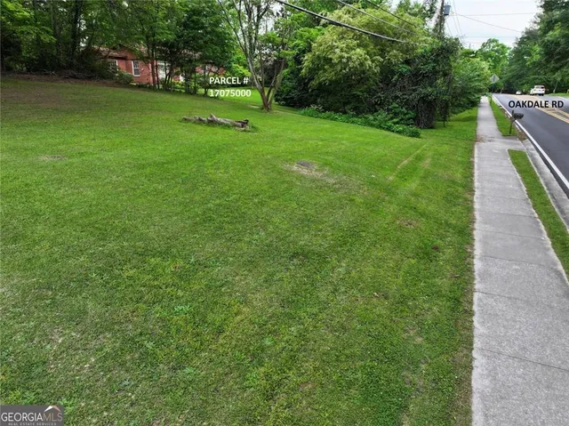 an aerial view of a house with a yard basket ball court and outdoor seating