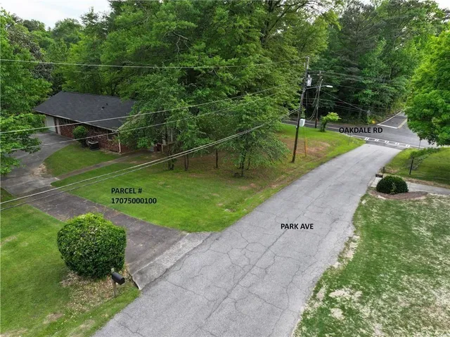 a backyard of a house with a yard and outdoor seating
