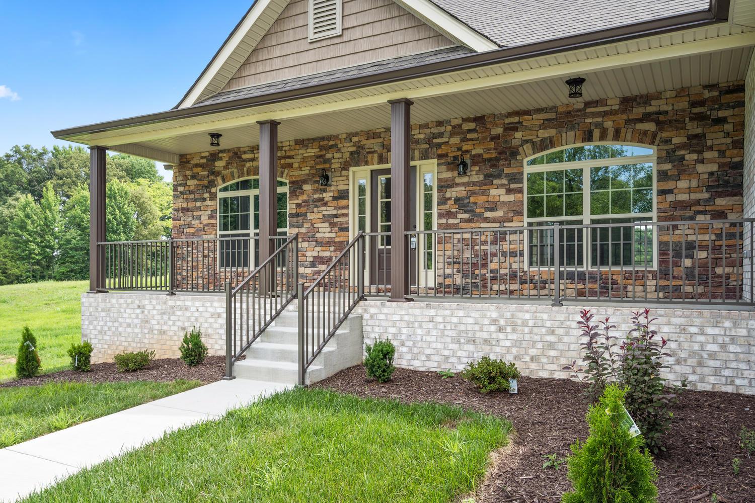 4347 Memory Lane Adams, TN 37010 - Photo 2 of 30 a front view of a house with garden