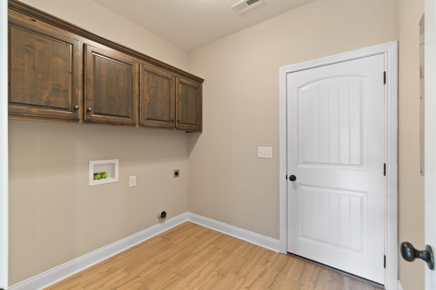 4347 Memory Lane Adams, TN 37010 - Photo 13 of 30 a view of an empty room with wooden floor and a window