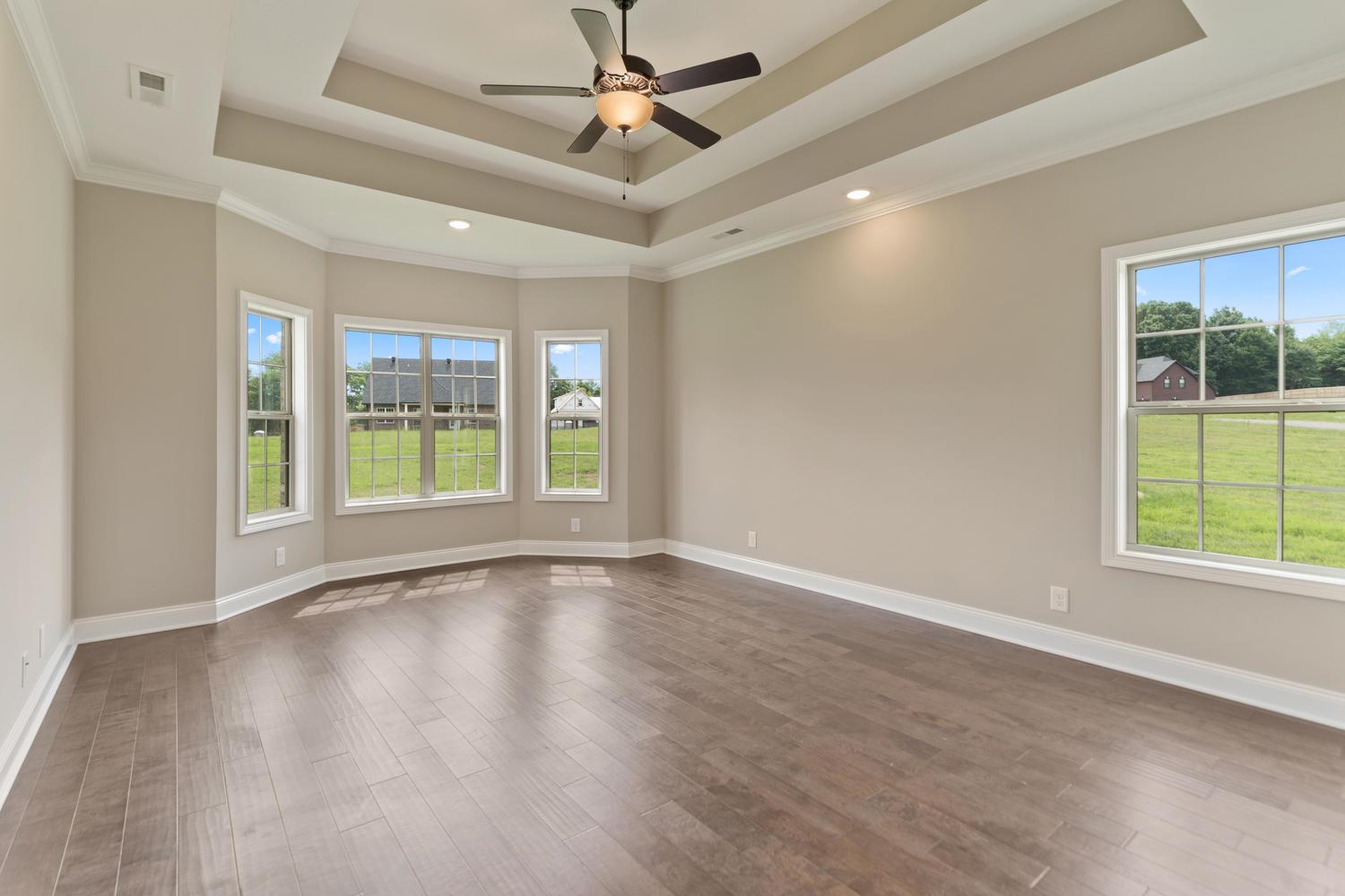 4347 Memory Lane Adams, TN 37010 - Photo 14 of 30 a view of an empty room with a window and wooden floor