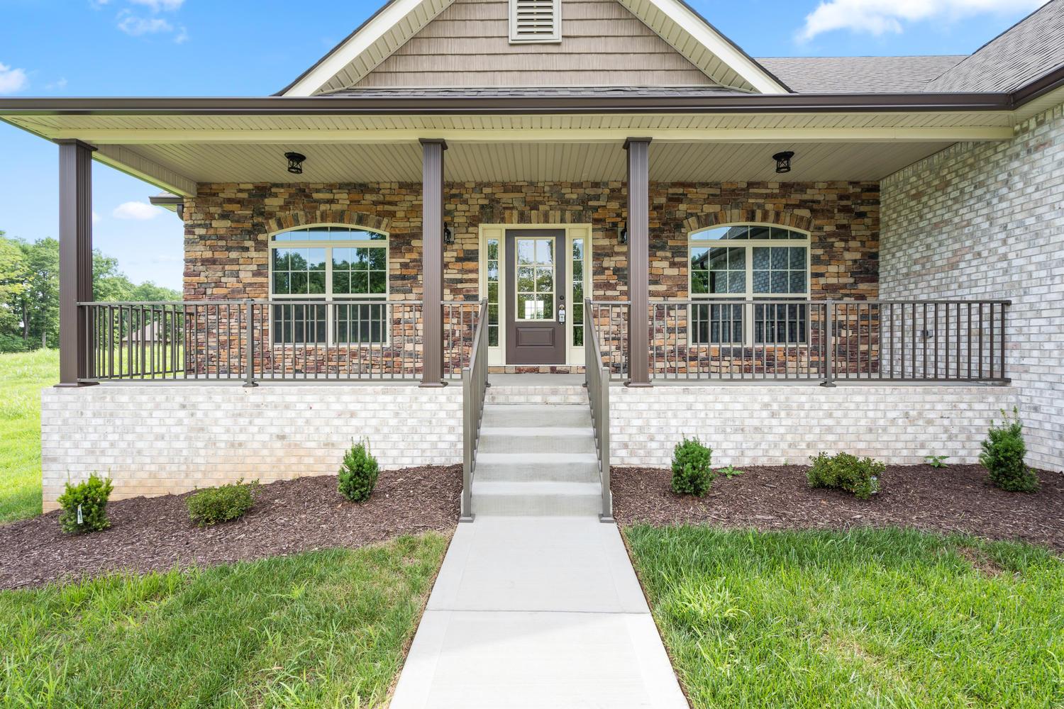 4347 Memory Lane Adams, TN 37010 - Photo 3 of 30 a front view of a house with a garden and plants