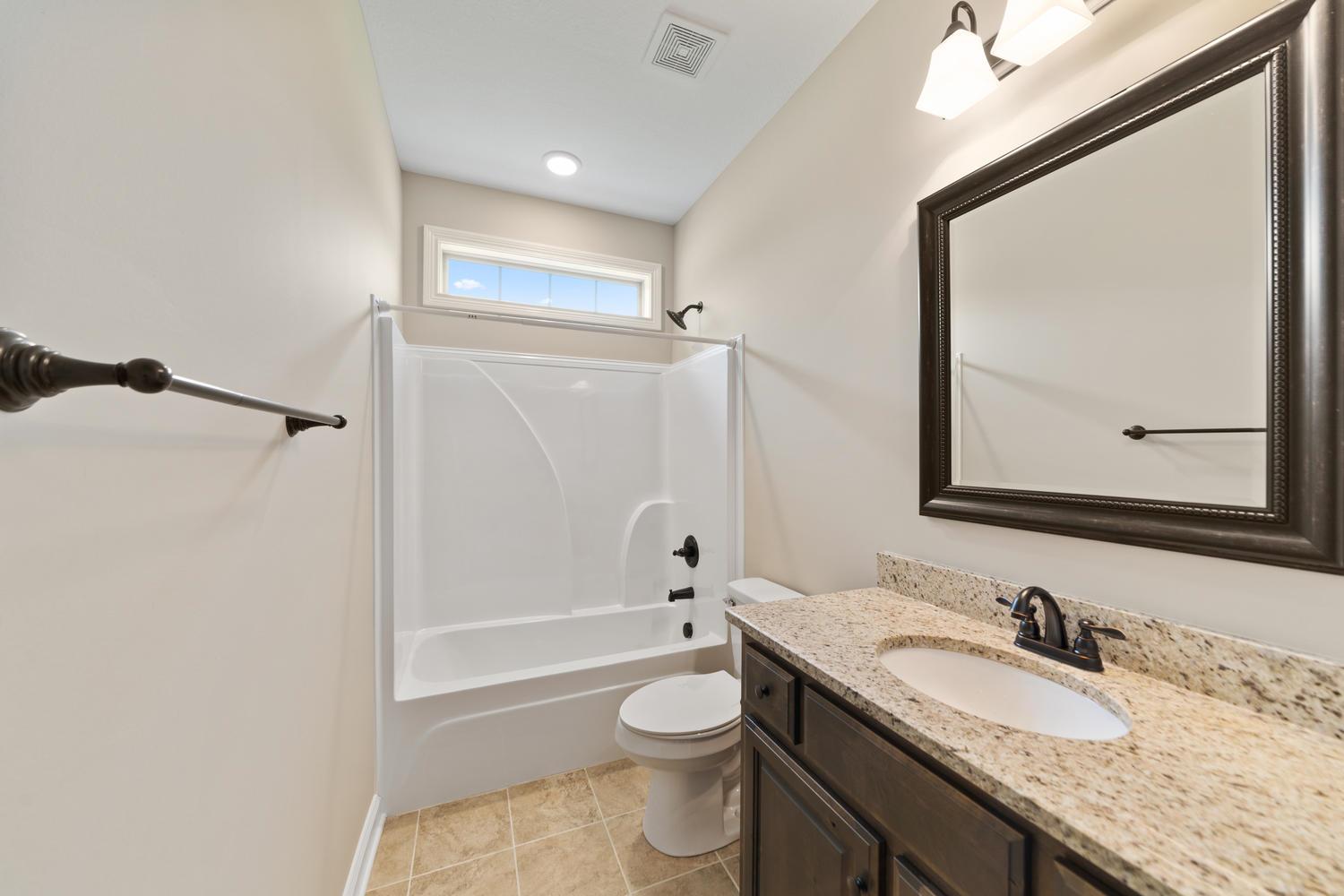 4347 Memory Lane Adams, TN 37010 - Photo 23 of 30 a bathroom with a granite countertop sink toilet and shower