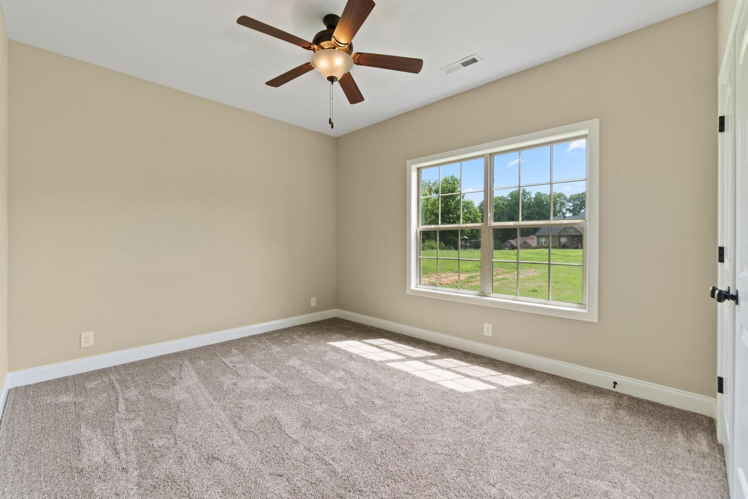 4347 Memory Lane Adams, TN 37010 - Photo 27 of 30 an empty room with a window and a fan