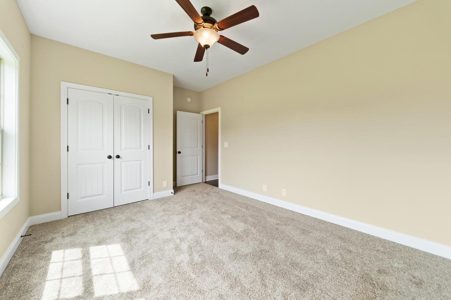 4347 Memory Lane Adams, TN 37010 - Photo 28 of 30 an empty room with chandelier fan