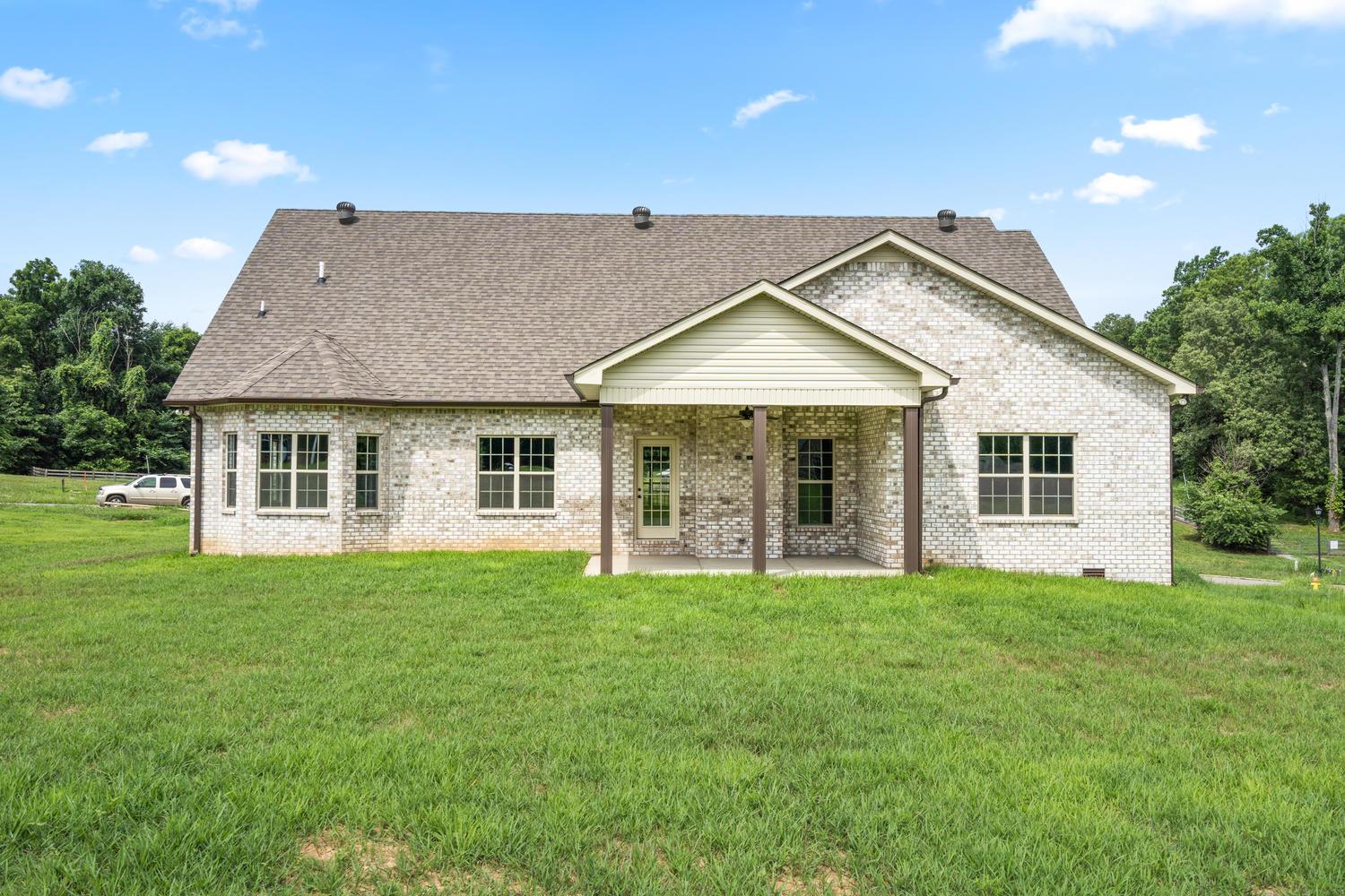 4347 Memory Lane Adams, TN 37010 - Photo 30 of 30 a front view of a house with a yard