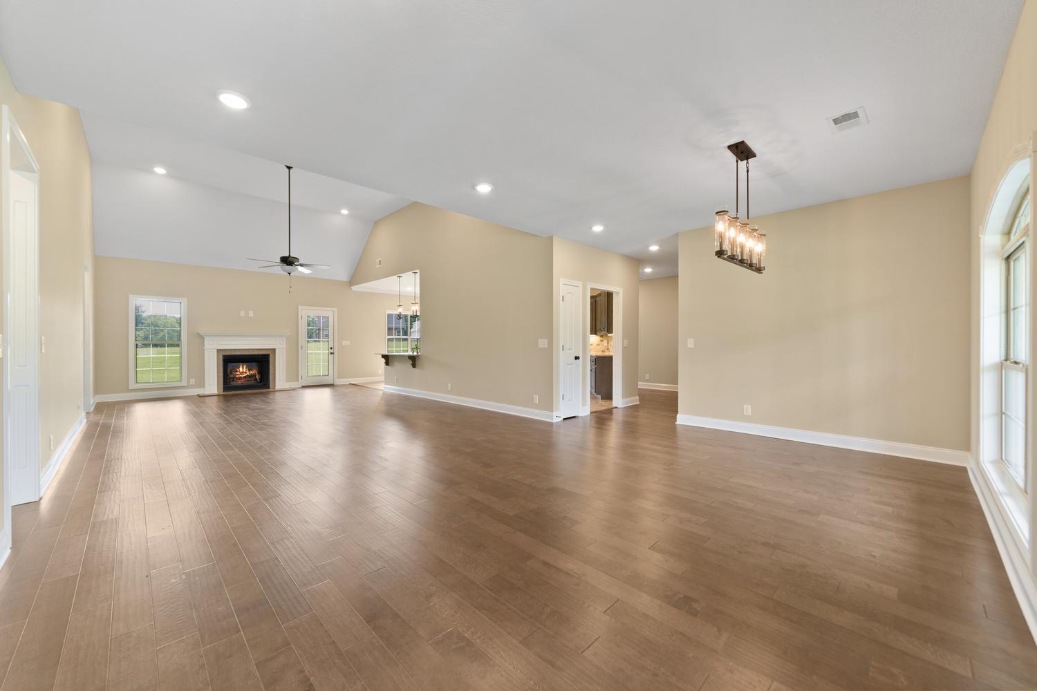 4347 Memory Lane Adams, TN 37010 - Photo 4 of 30 an empty room with wooden floor and windows