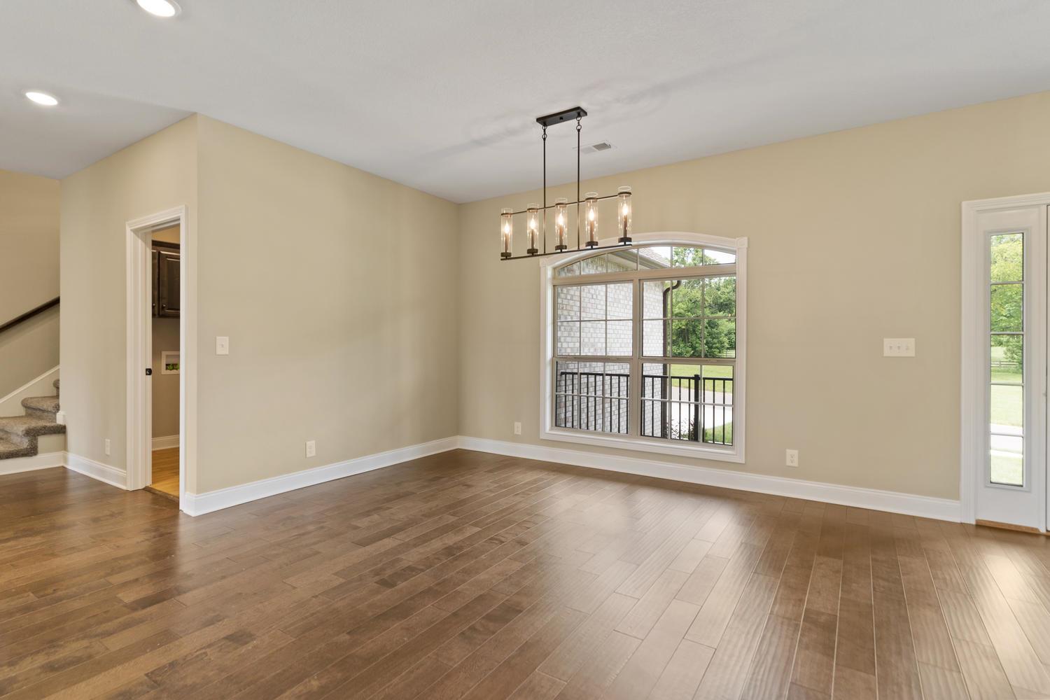 4347 Memory Lane Adams, TN 37010 - Photo 8 of 30 a view of an empty room with wooden floor and a window