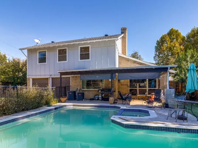 a view of pool with outdoor seating