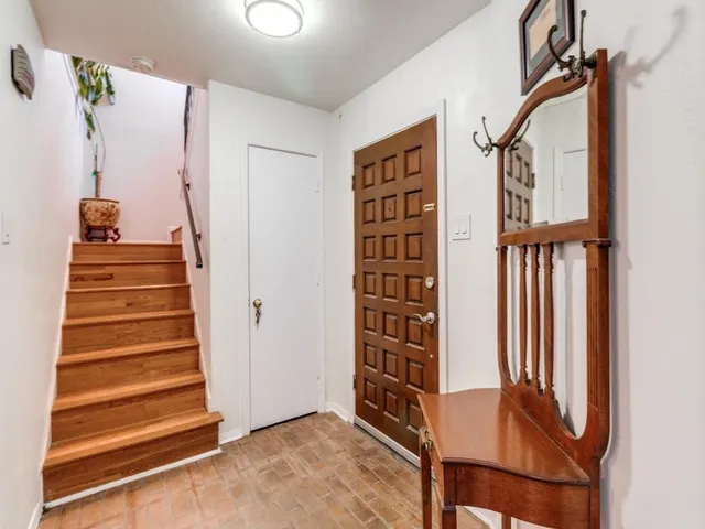 a view of entryway with stairs and furniture