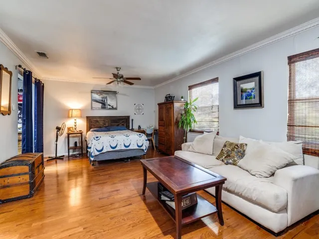 a living room with furniture and a table
