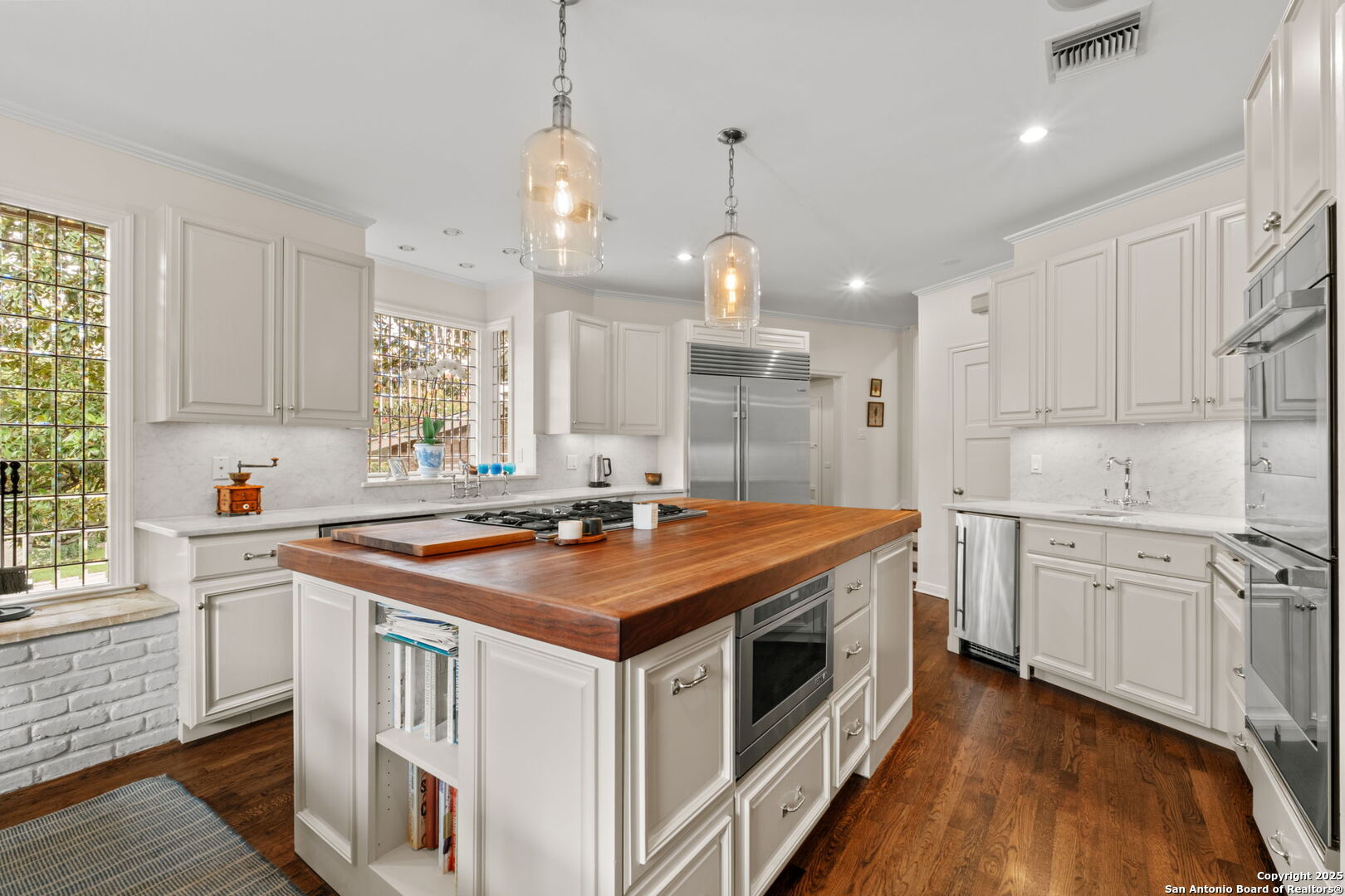 701 Ridgemont Avenue Terrell Hills, TX 78209 - Photo 11 of 48 a kitchen with stainless steel appliances granite countertop a stove a sink and a refrigerator