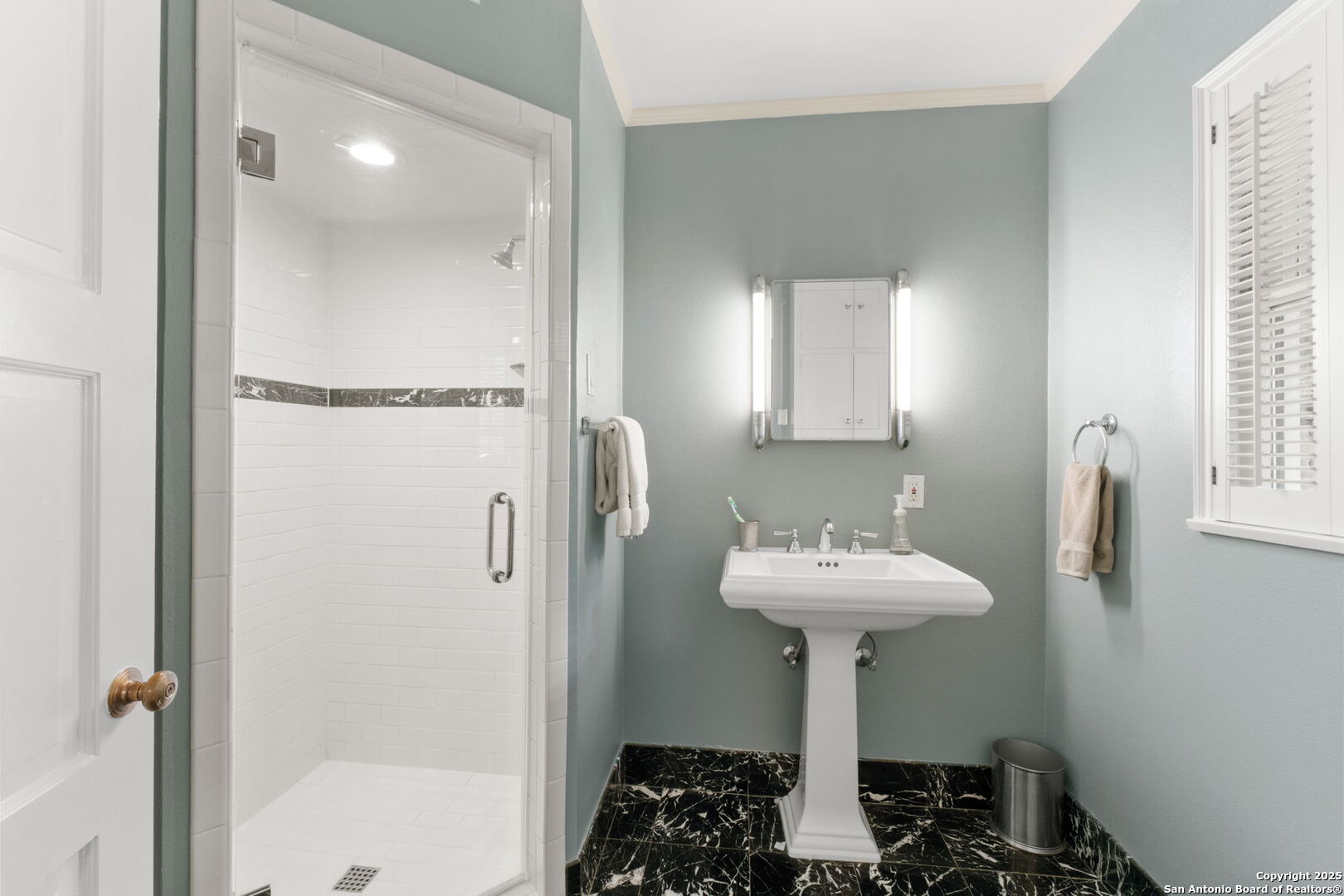 701 Ridgemont Avenue Terrell Hills, TX 78209 - Photo 28 of 48 a bathroom with a sink a mirror and a shower