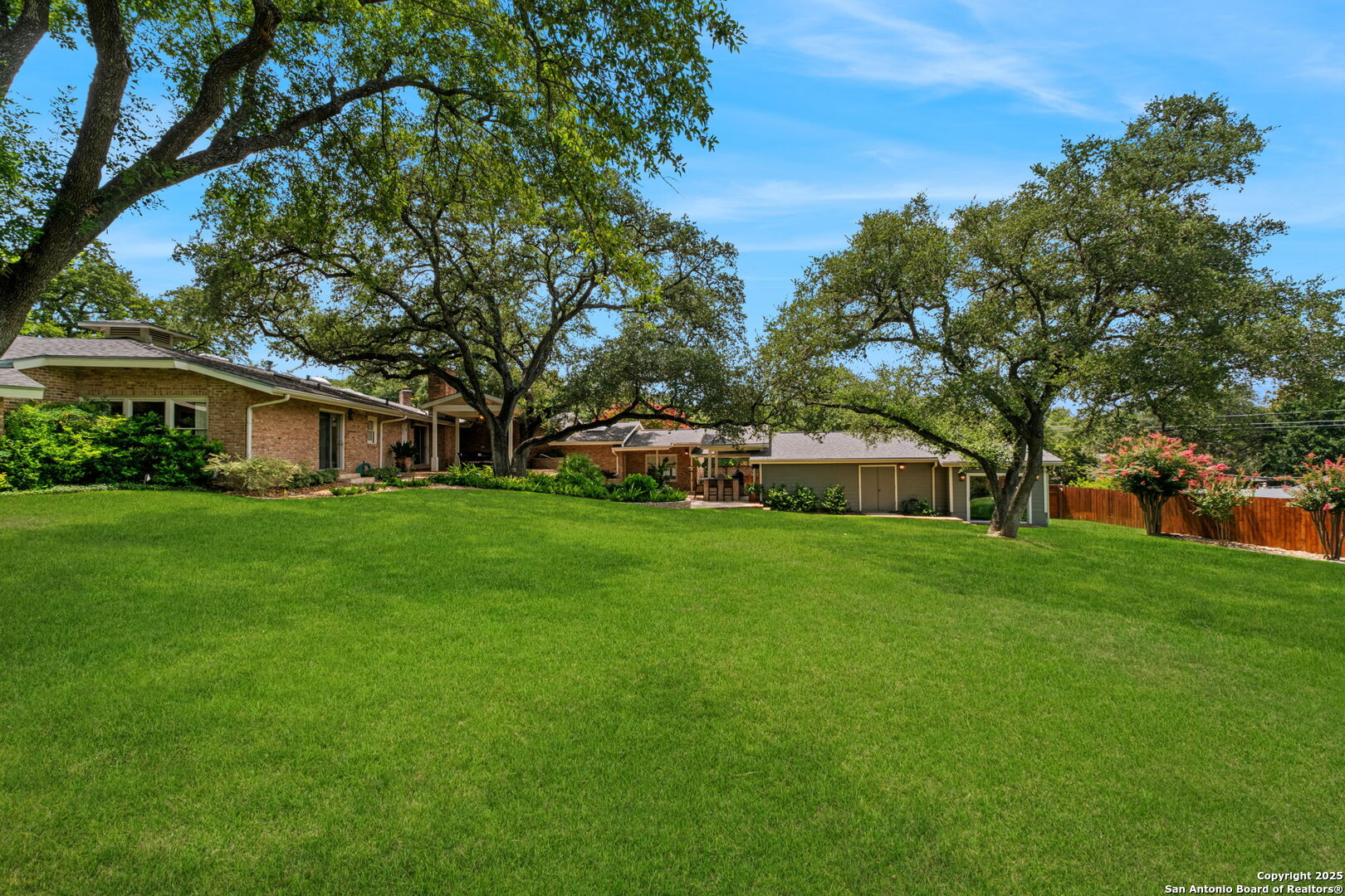 701 Ridgemont Avenue Terrell Hills, TX 78209 - Photo 46 of 48 a front view of a house with a yard and trees