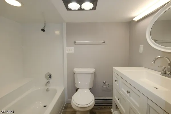 a bathroom with a sink a toilet and a bathtub