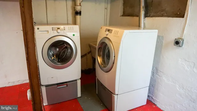 a utility room with dryer and washer