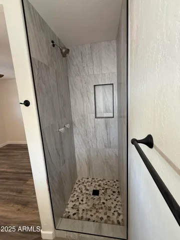 a bathroom with a sink and a shower
