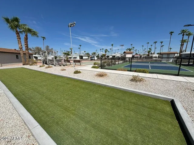 a view of a swimming pool and a chairs