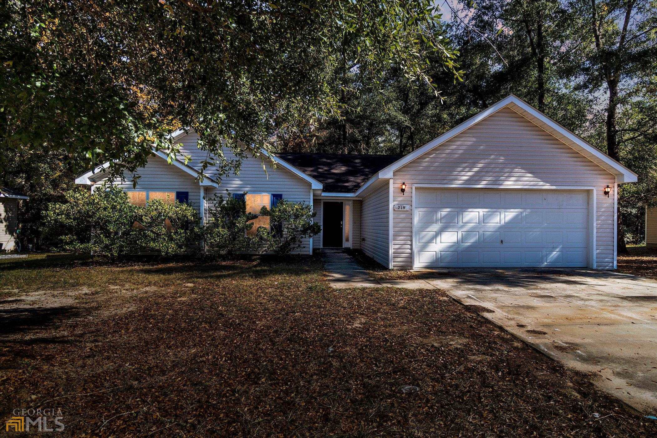 219 Stag Road Springfield, GA 31329 - Photo 1 of 1 a front view of a house with a yard and garage
