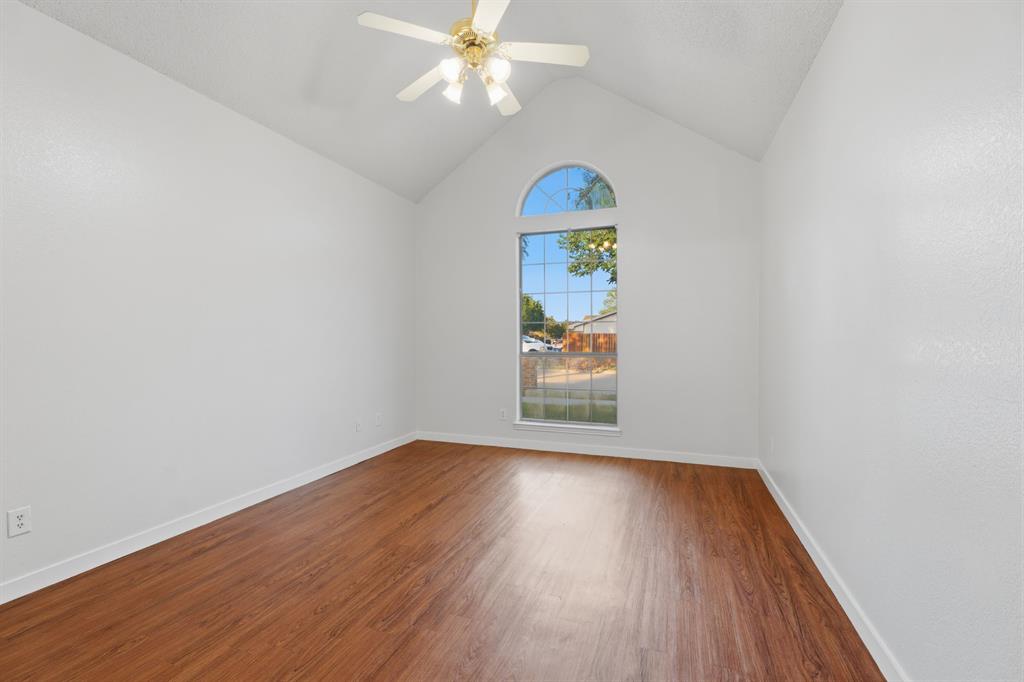 3721 Smartt Street Rowlett, TX 75088 - Photo 6 of 27 an empty room with wooden floor and fan