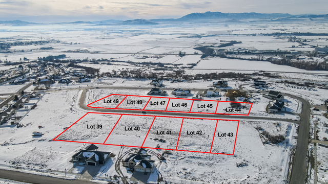 669 Cherry Ridge Lane, Unit 47 Richmond, UT 84333 - Photo 4 of 6 Snowy aerial view with property boundaries highlighted and a mountain view