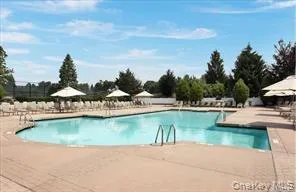 a living room with lots of furniture and a chandelier