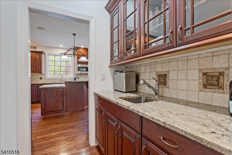 1 Brodziak Road Denville, NJ 07834 - Photo 13 of 42 a kitchen with stainless steel appliances granite countertop a sink and stove top oven