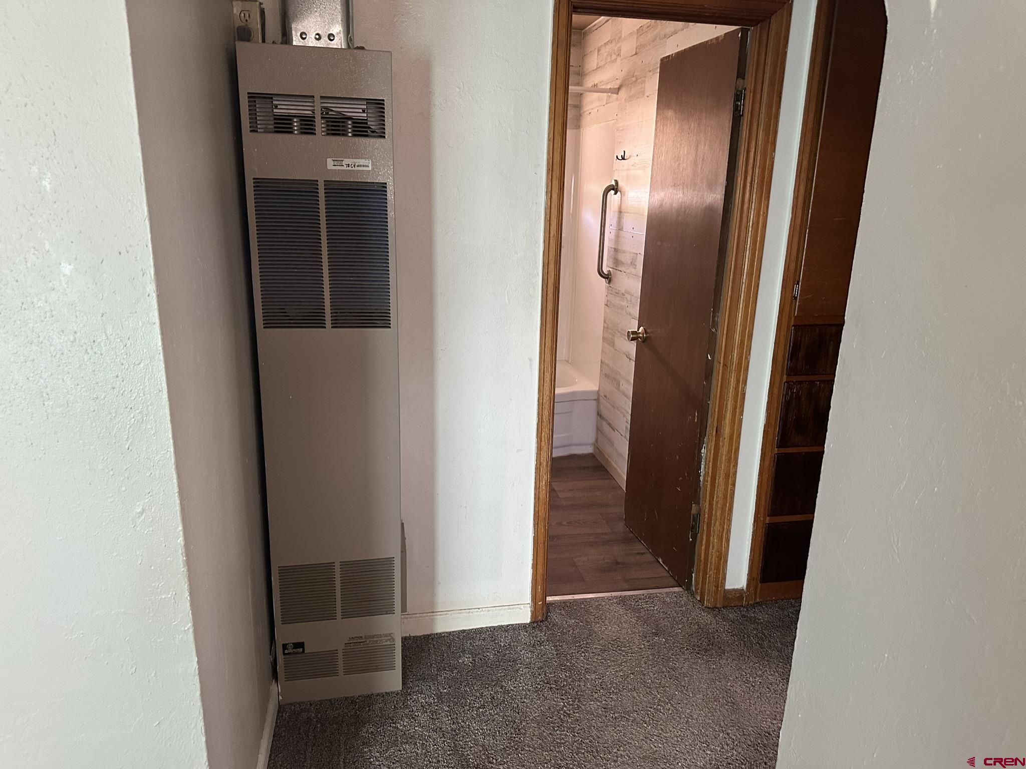 435 South Elm Street Cortez, CO 81321 - Photo 8 of 17 a view of a hallway with wooden floor
