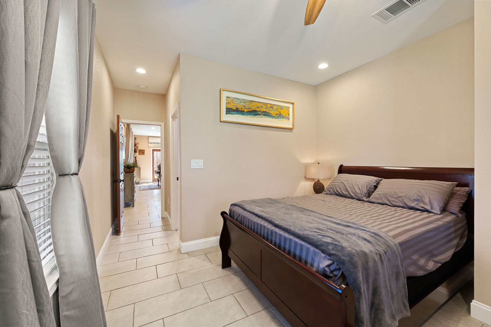 1602 Plateau Ridge Cedar Park, TX 78613 - Photo 13 of 29 Bedroom featuring light tile patterned floors, ceiling fan, and recessed lighting