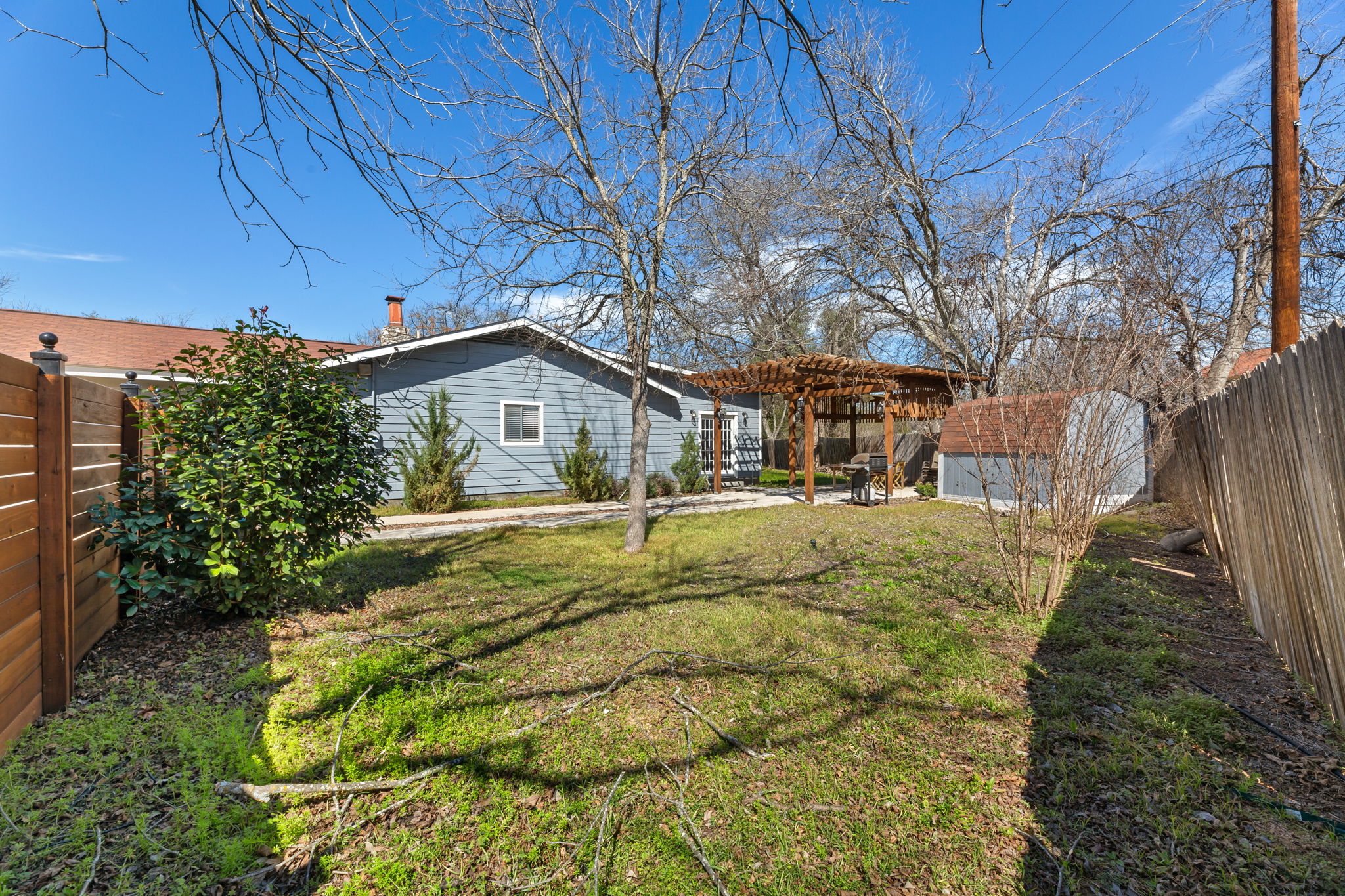 1602 Plateau Ridge Cedar Park, TX 78613 - Photo 23 of 29 Rear view of property with a fenced backyard, a pergola, a patio area, and a shed