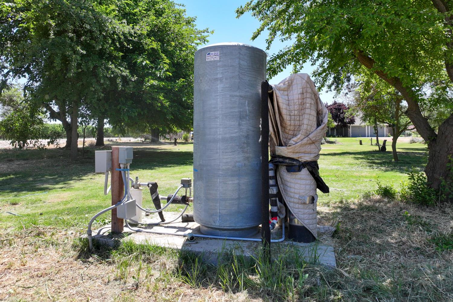 9415 21st Avenue Lemoore, CA 93245 - Photo 15 of 36 a backyard of a house with yard and trampoline